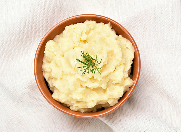 Mashed potato in ceramic bowl stock photo