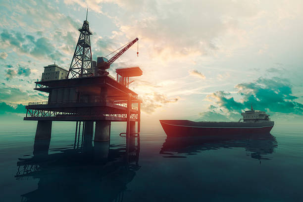 istock Sea oil rig with approaching tanker ship at sunset 536555363