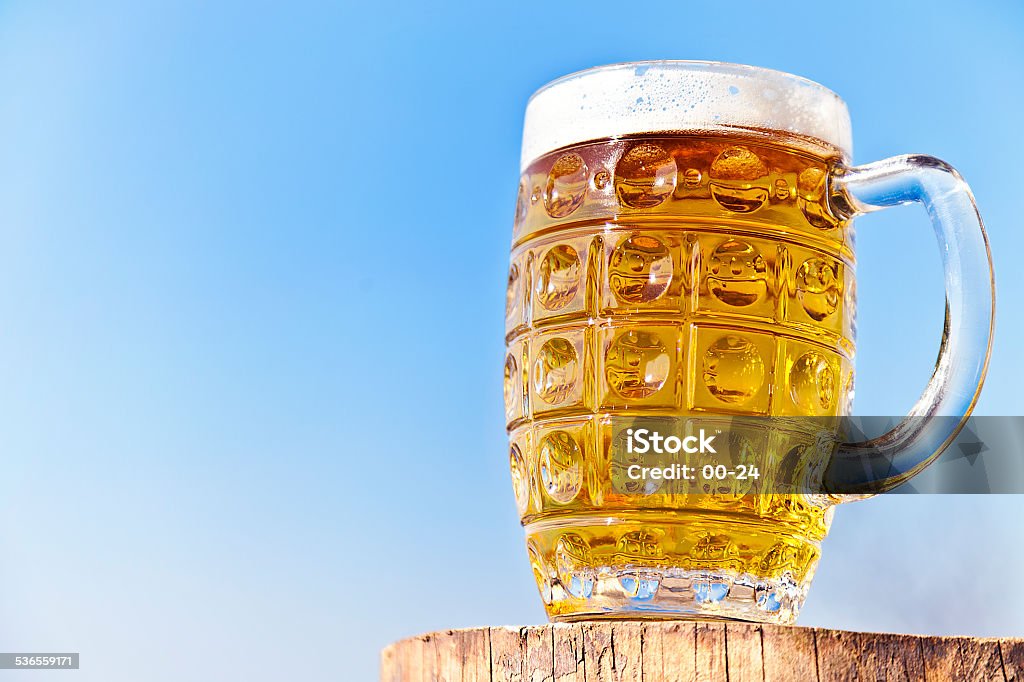 Beer on the stump Beer on the stump, heavenly beer. blue sky, a 2015 Stock Photo