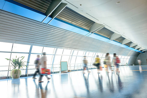 istock passenger walking in airport corridor 536559803