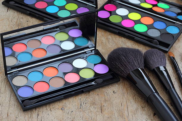 istock Makeup brushes make-up eye shadows vintage wooden background 536610215