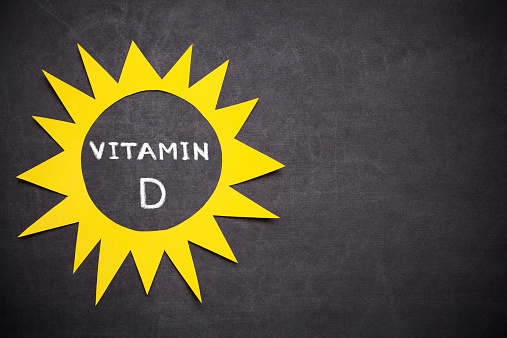 Sun and ,,Vitamin D'' written on blackboard