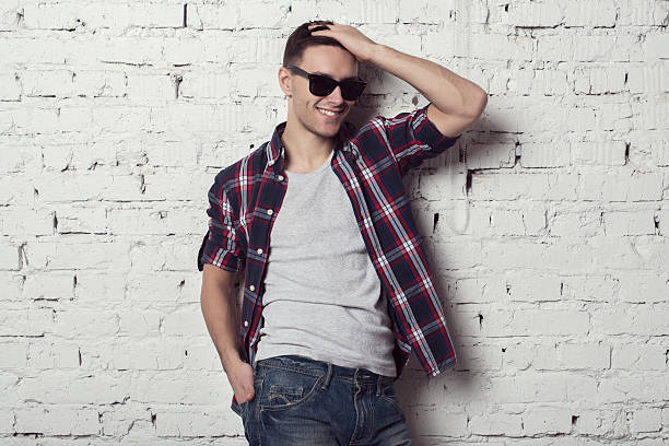 istock Young handsome attractive man hipster with sunglasses his hand in 536613179