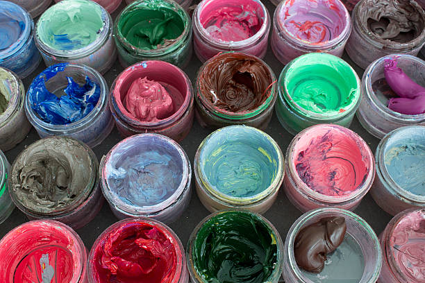 istock Oil paint in round containers background 536613394