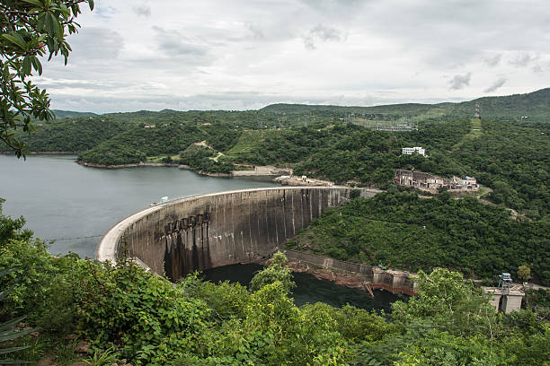 Dam wall at Lake Kariba, Zimbabwe Photograph of Lake Kariba's dam wall where a hydroelectric plant is located and is also the border crossing point between Zimbabwe and Zambia lake kariba stock pictures, royalty-free photos & images