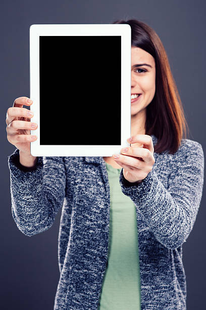 istock Young girl holding tablet 536613553