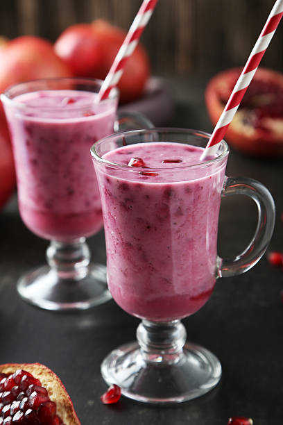 istock Pomegranate smoothie in glass on black background 536613729