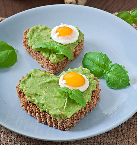 Sandwich with avocado paste and egg