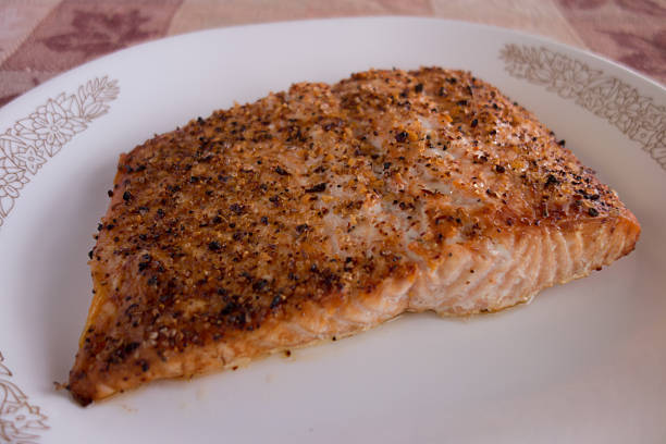 istock Broiled salmon with spices on white plate 536614261