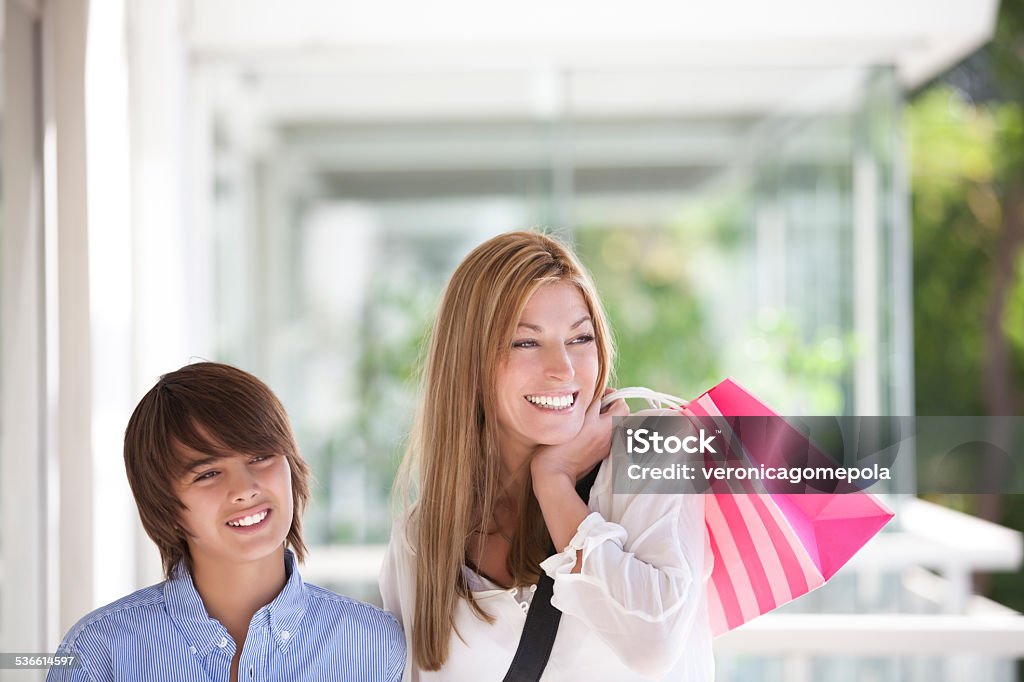 Beautiful mother spending time with her son beautiful mother spending time with her son and smiling Adult Stock Photo