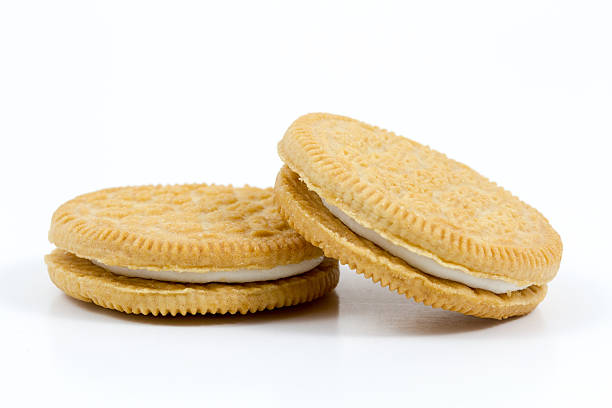 istock Vanilla cookies with cream filling on white background 536614877