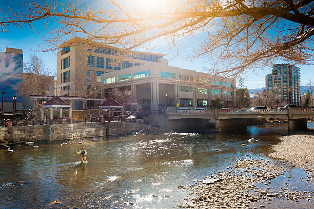 A fly fisherman in a river in a downtown urban area. http://blog.michaelsvoboda.com/FishingBanner.jpg