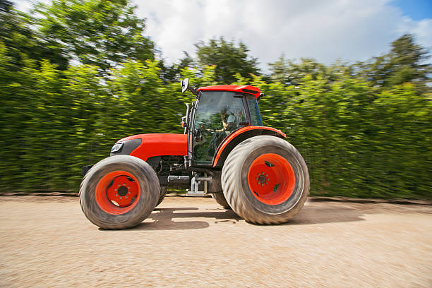 istock Man with tractor in a garden, blurred motion 536616947