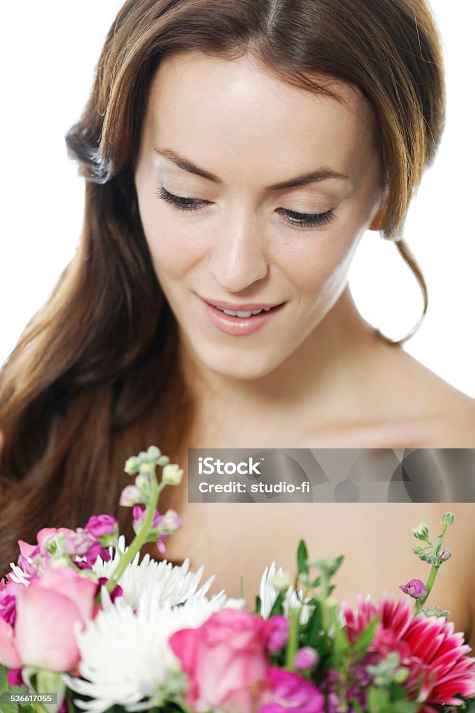 Woman holding a bouquet of flowers Attractive young woman holding a colourful bouquet of flowers smiling 20-29 Years Stock Photo