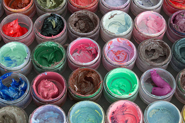 istock Oil paint in round containers background 536617170