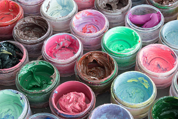 istock Oil paint in round containers background 536636654