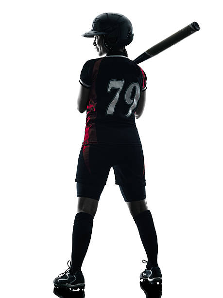 istock woman playing softball players silhouette isolated 536644164