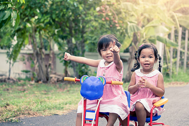 istock Child two little girls looking something 536647080