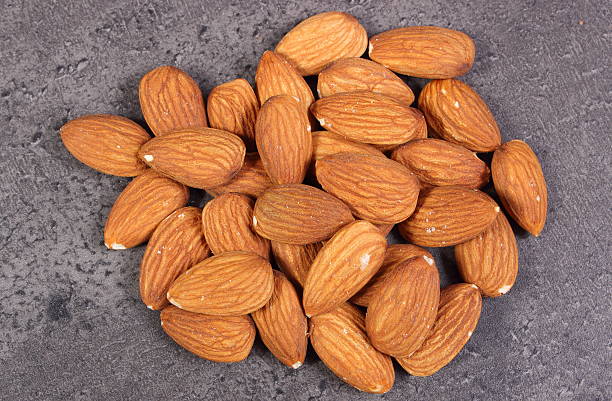 istock Heap of almonds on concrete structure 536647588