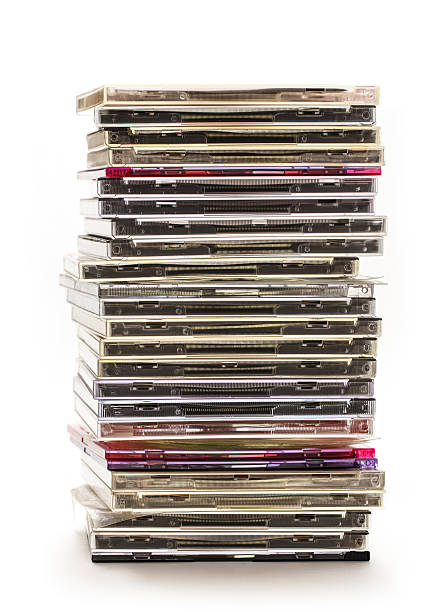 Pile of compact disks Pile of compact disks on white background compact disc stock pictures, royalty-free photos & images