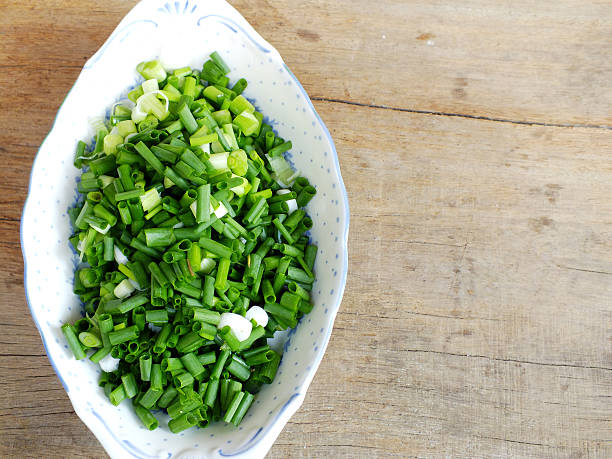 istock fresh spring onion chopped green onions on wooden background 536650234