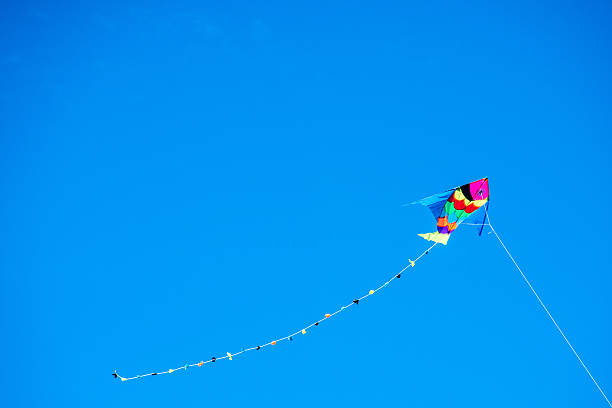 istock colorful kite flying in the wind 536654624