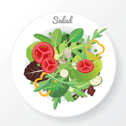 Fresh vegetable and green leaf salad dish.