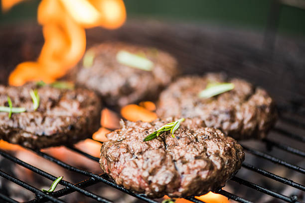 istock grilling meat on bbq flames 536657256