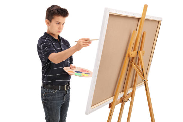istock Little kid painting on a canvas 536660026