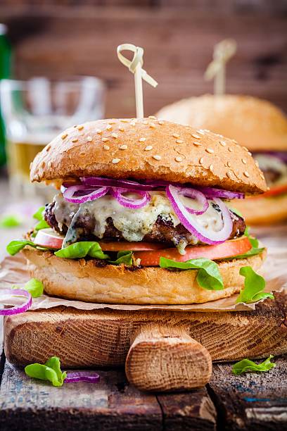 istock homemade burger with beef cutlet, apple, lettuce, onion, blue cheese 536661744