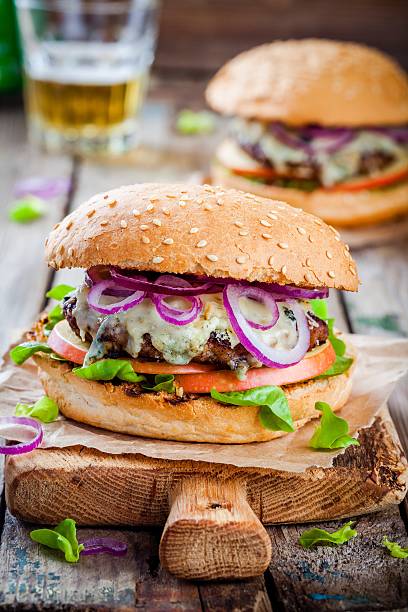 istock homemade burger with beef cutlet, apple, lettuce, onion, blue cheese 536661792