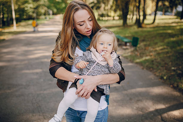 istock young family walking in the park 536665498