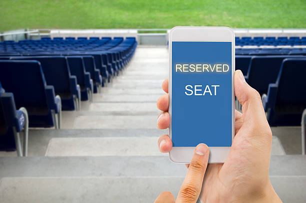 istock reserving a seat with a smart phone 536665806