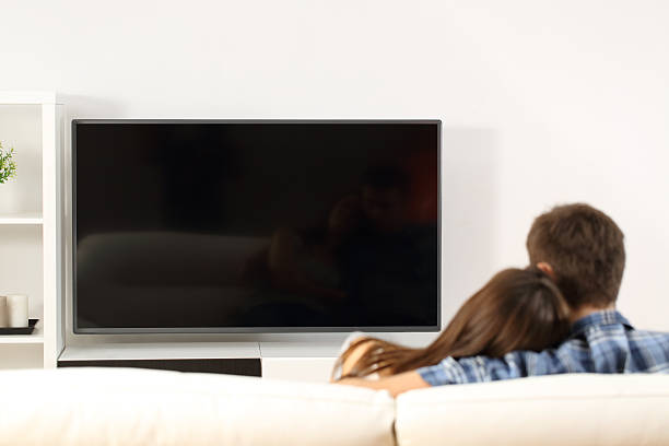 istock Couple watching tv screen view 536666824