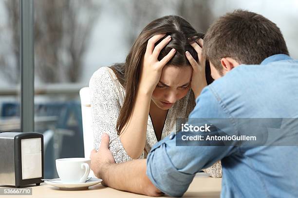 Man Comforting A Sad Depressed Girl Stock Photo - Download Image Now - Infidelity, Couple - Relationship, Anger