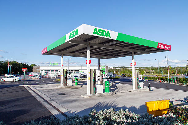 Asda - Petrol Station Swansea, UK: May 22, 2016: A self-service petrol station at an Asda supermarket. Asda Stores Limited is an American-owned, British-founded supermarket retailer, headquartered in Leeds, West Yorkshire.  asda photos stock pictures, royalty-free photos & images
