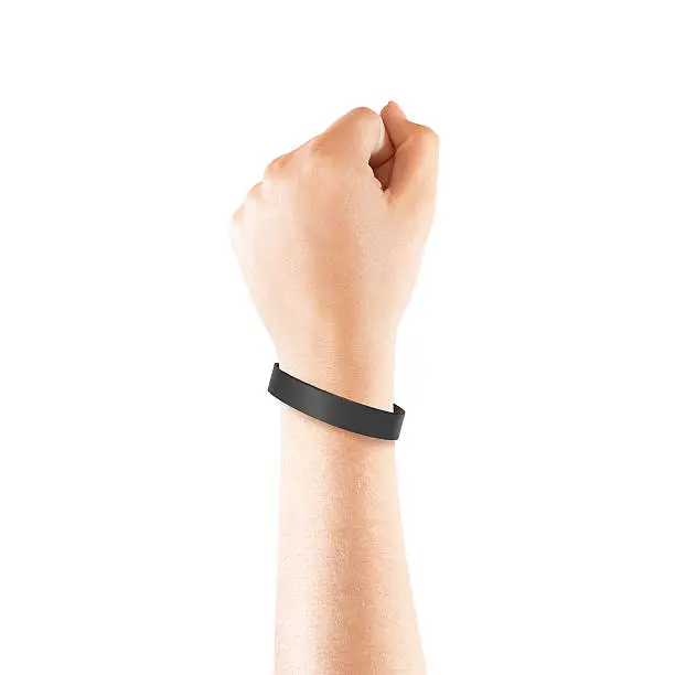 Photo of Blank black rubber wristband mockup on hand, isolated