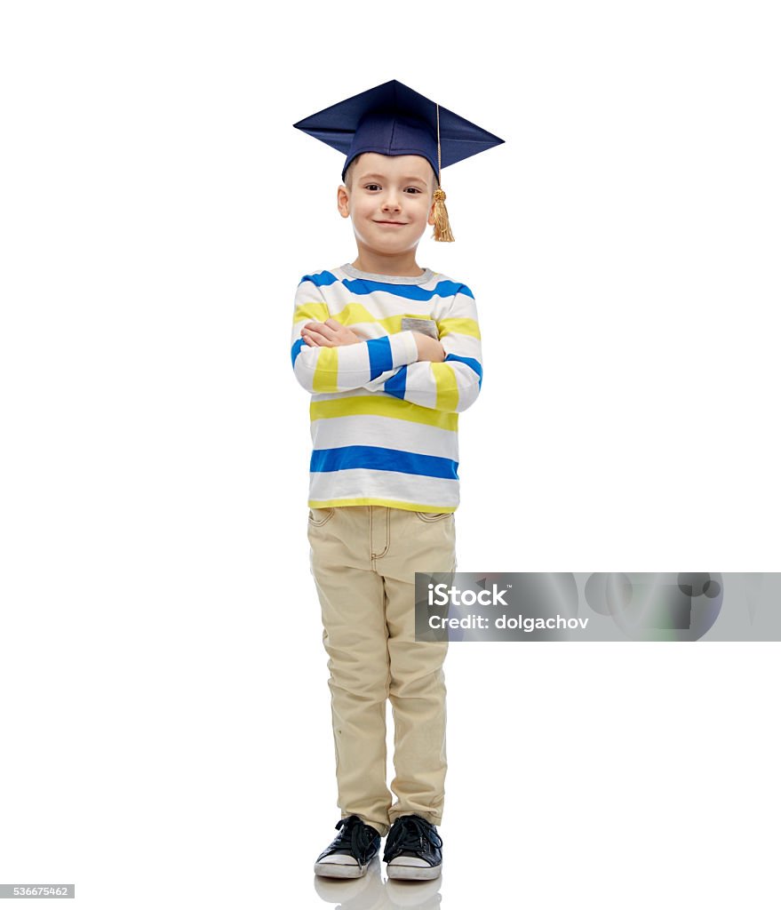 happy boy in bachelor hat or mortarboard childhood, school, education, learning and people concept - happy boy in bachelor hat or mortarboard Child Stock Photo