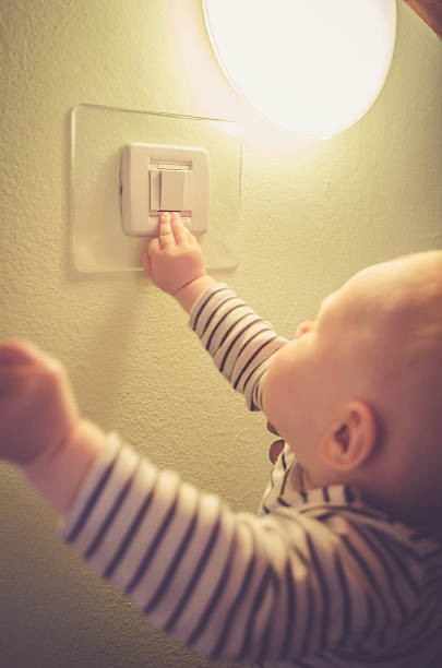 istock Baby child switching on / off the light 536675918