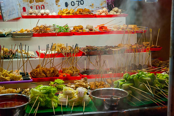 istock Food stall with various snacks at night market 536676100