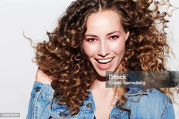 Beautiful Brunette Model Smiling At Camera Stock Photo - Download Image Now - Curly Hair, One Woman Only, White People