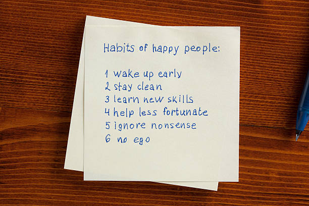 istock Habit of happy people written on note 536676592