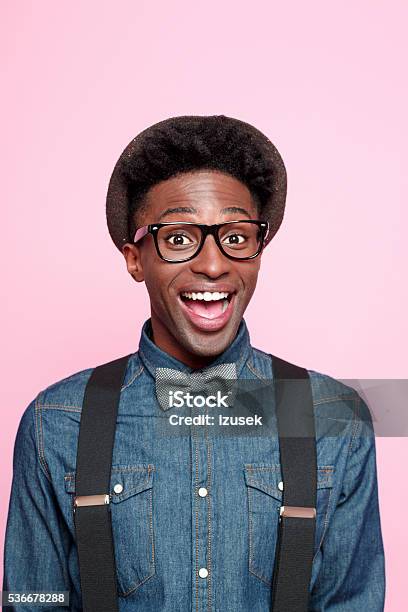Portrait Of Excited Afro American Young Man Stock Photo - Download Image Now - Nerd, Men, Eyeglasses