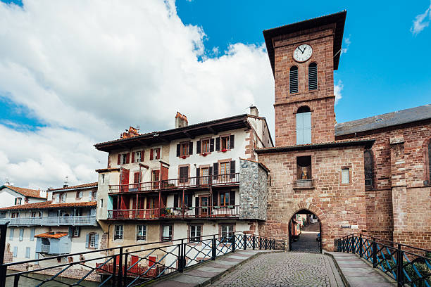 Saint-Jean Saint-Jean-Pied-de-Port, France - April 1, 2016: River Nive crosses the old town of Saint-Jean-Pied-de-Port. Saint-Jean-Pied-de-Port is a popular destination in French Basque Country. saint jean pied de port stock pictures, royalty-free photos & images