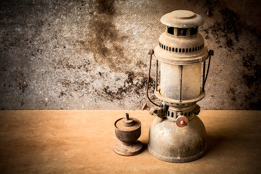 still life of old hurricane lamp and kerosene lamp