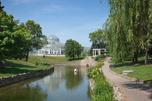 The Marjorie MacNeely Conservatory at Como Park in St. Paul Minnesota on a bright summer afternoon