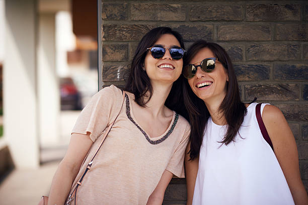 istock Two attractive girls posing and smiling outdoor 536682900