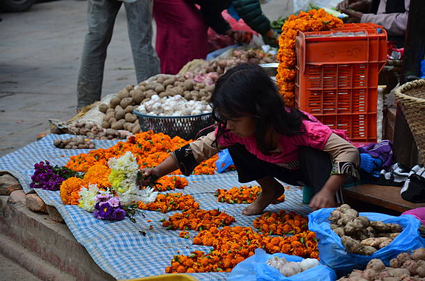 Garlands of flowers and lotus blossoms adorn the Makutabandhana Stupa in India, creating a serene and vibrant tribute to devotion and timeless spirituality.