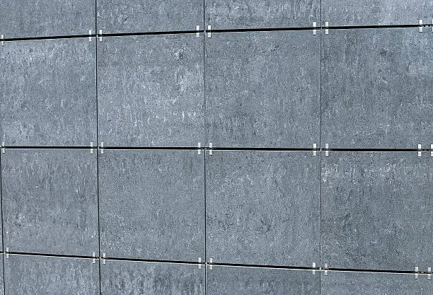 Photo of The surface of the walls decorated facade gray tiles