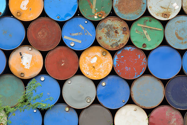 istock Front view of many metal iron barrels. 536684002